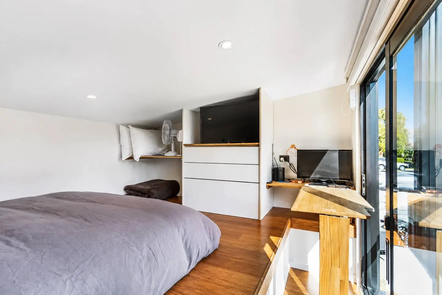 Loft bedroom detail with queen bed